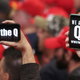 Trump supporters waving Q messages on their phones at a Trump rally in Las Vegas on February 22, 2020.